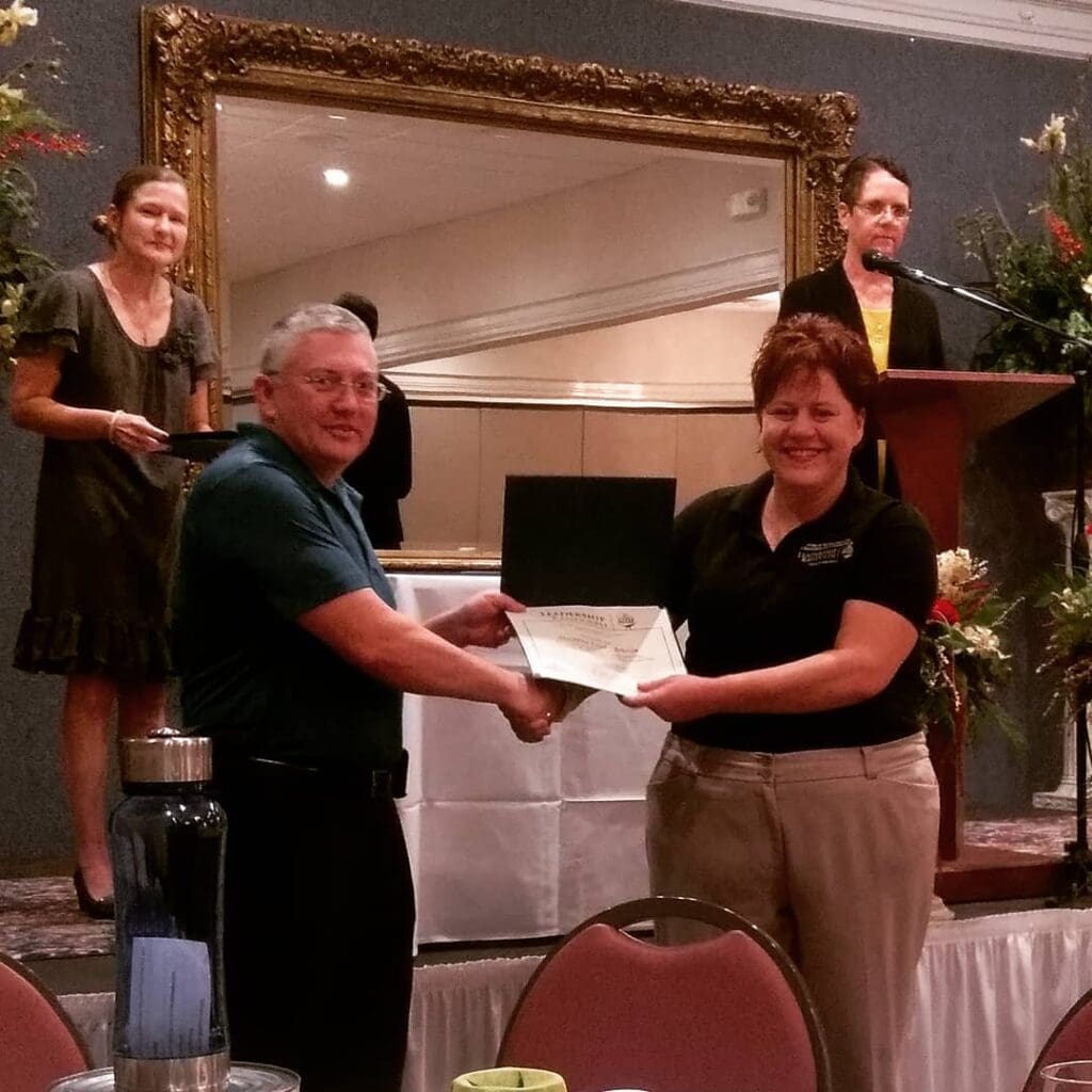 Al LaPrade presents Suzanna Chriscoe diploma of completion for Leadership Randolph program.